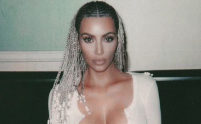Kim Kardashian claps back at critics over topless photoshoot